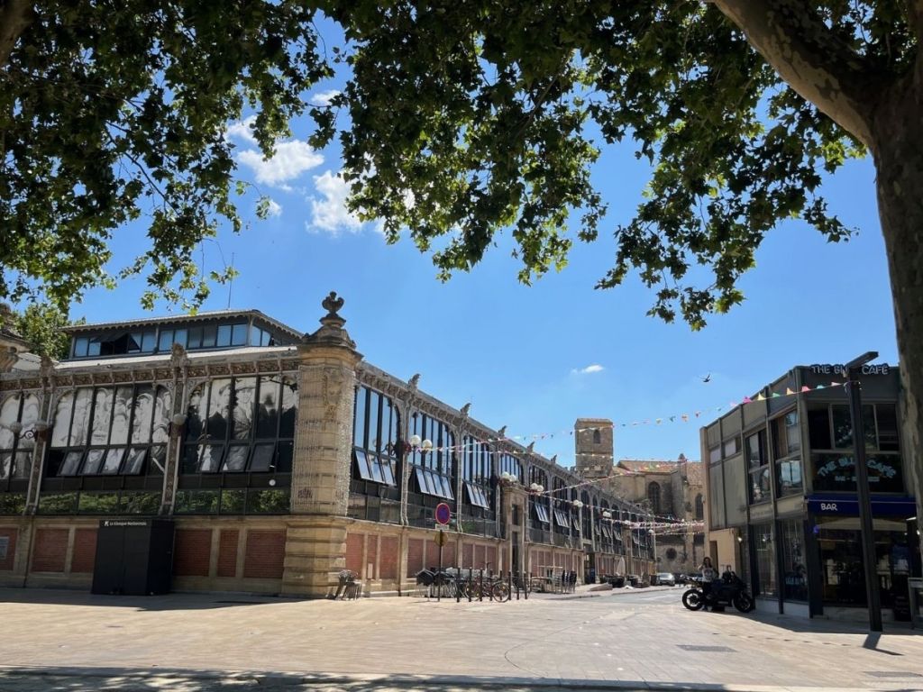 Iron-and-glass façade of the Narbonne market hall, Les Halles, in the Bourg district