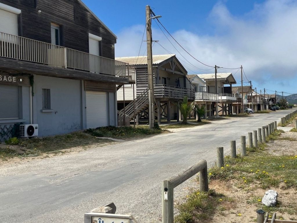 Row of wooden fishermen's chalets raised on stilts at Gruissan-les-Chalets, near Narbonne