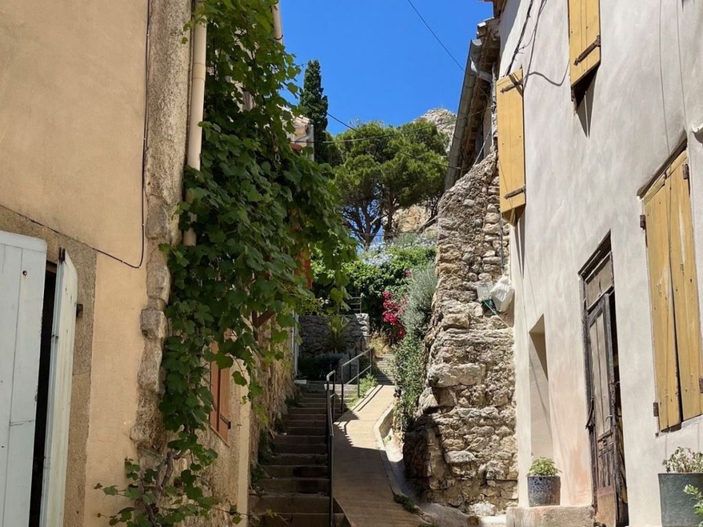 Narrow stone stairway alley in the old circular village of Gruissan, below the Barberousse Tower hill